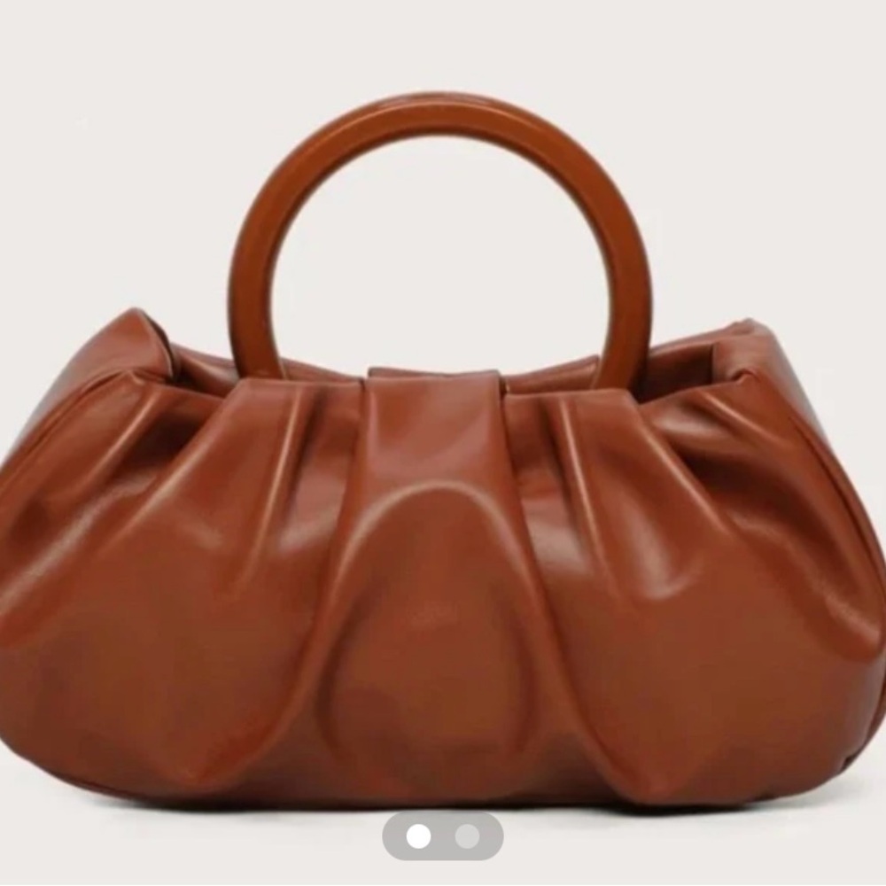 Sophisticated Brown Handbag with Circular Handles.